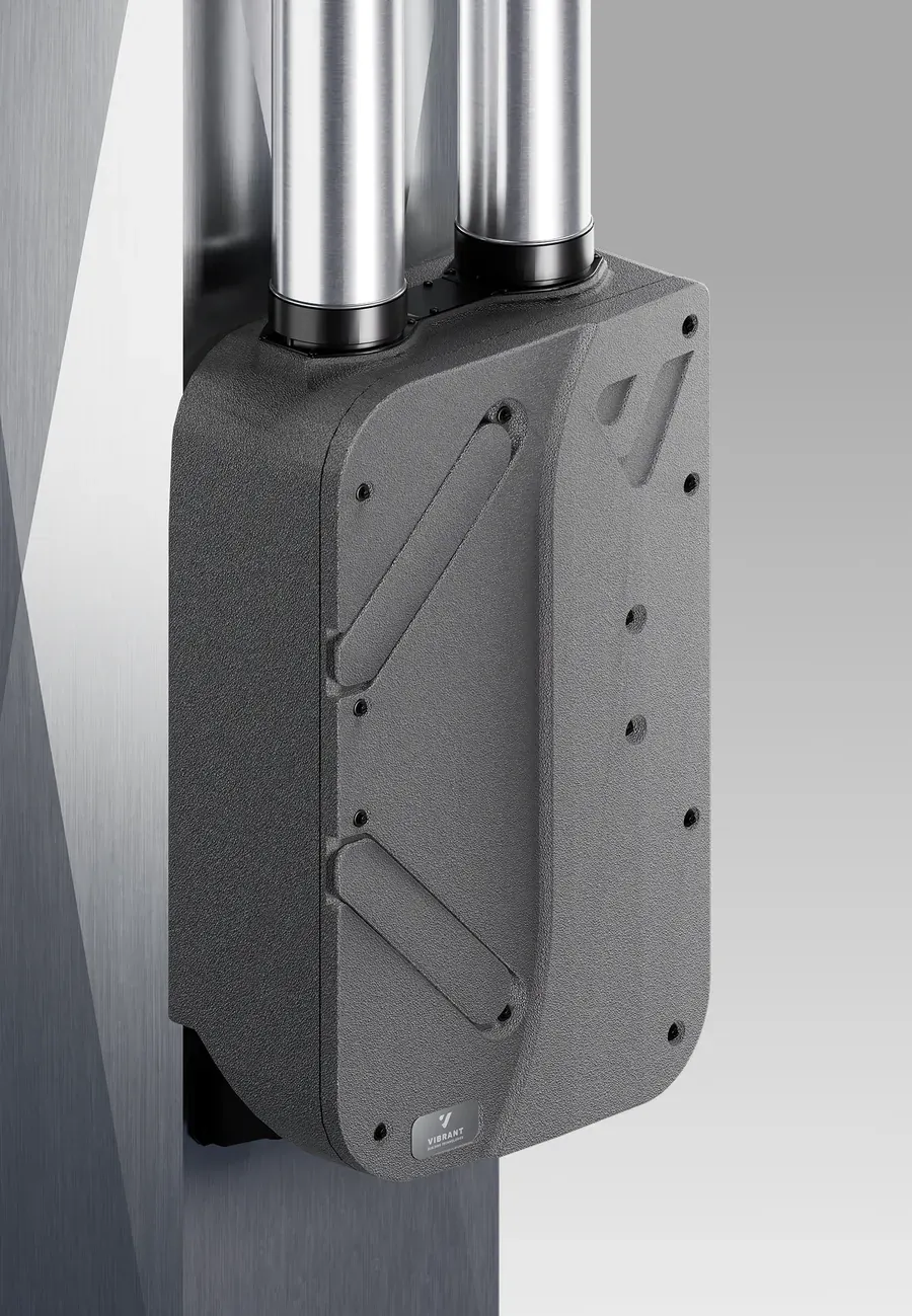 3D render of the Vibrant Air ERV: a textured charcoal housing with two steel ducts rising from it, mounted to a brushed-metal column.