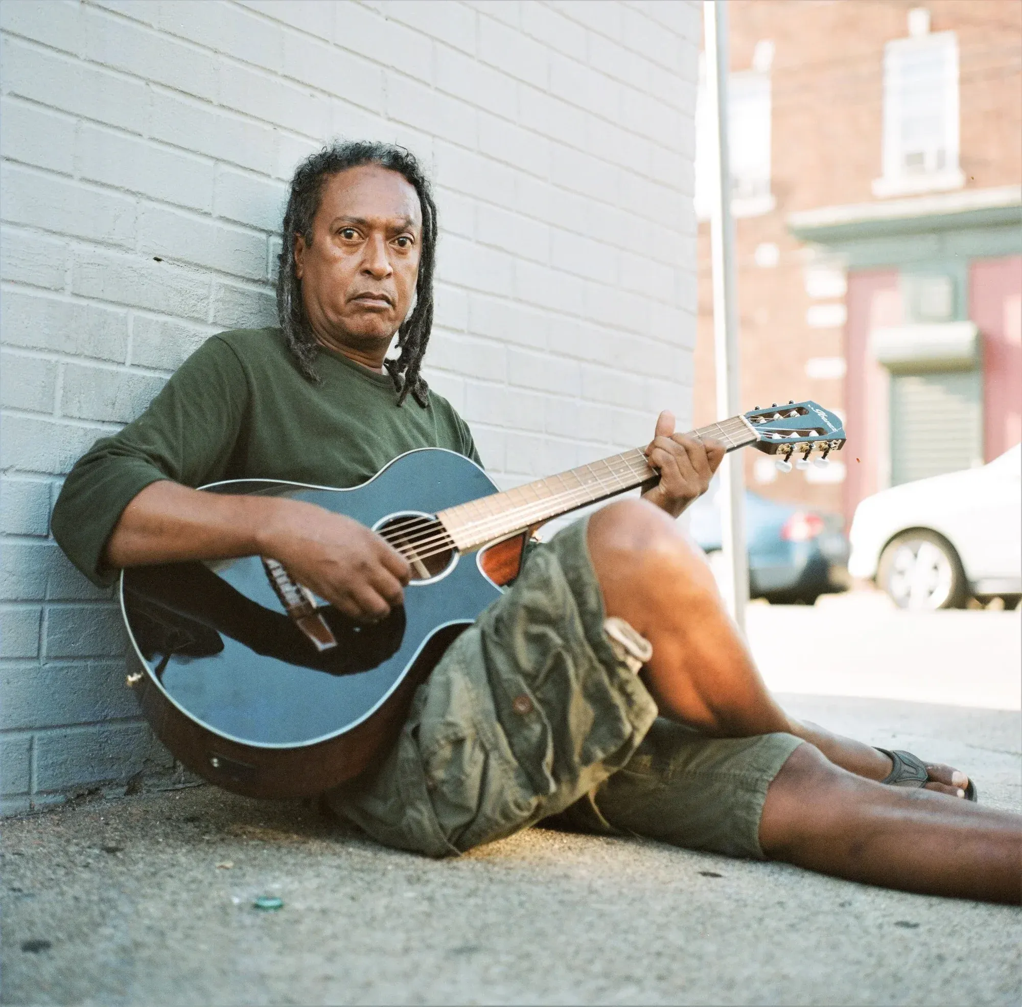 Portrait, Bridgeport CT — Henry playing guitar.