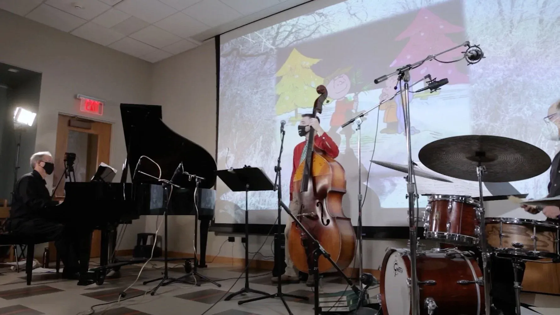 Film still from the Charlie Brown Christmas Concert — musicians performing at the Warner Library in Tarrytown, NY.