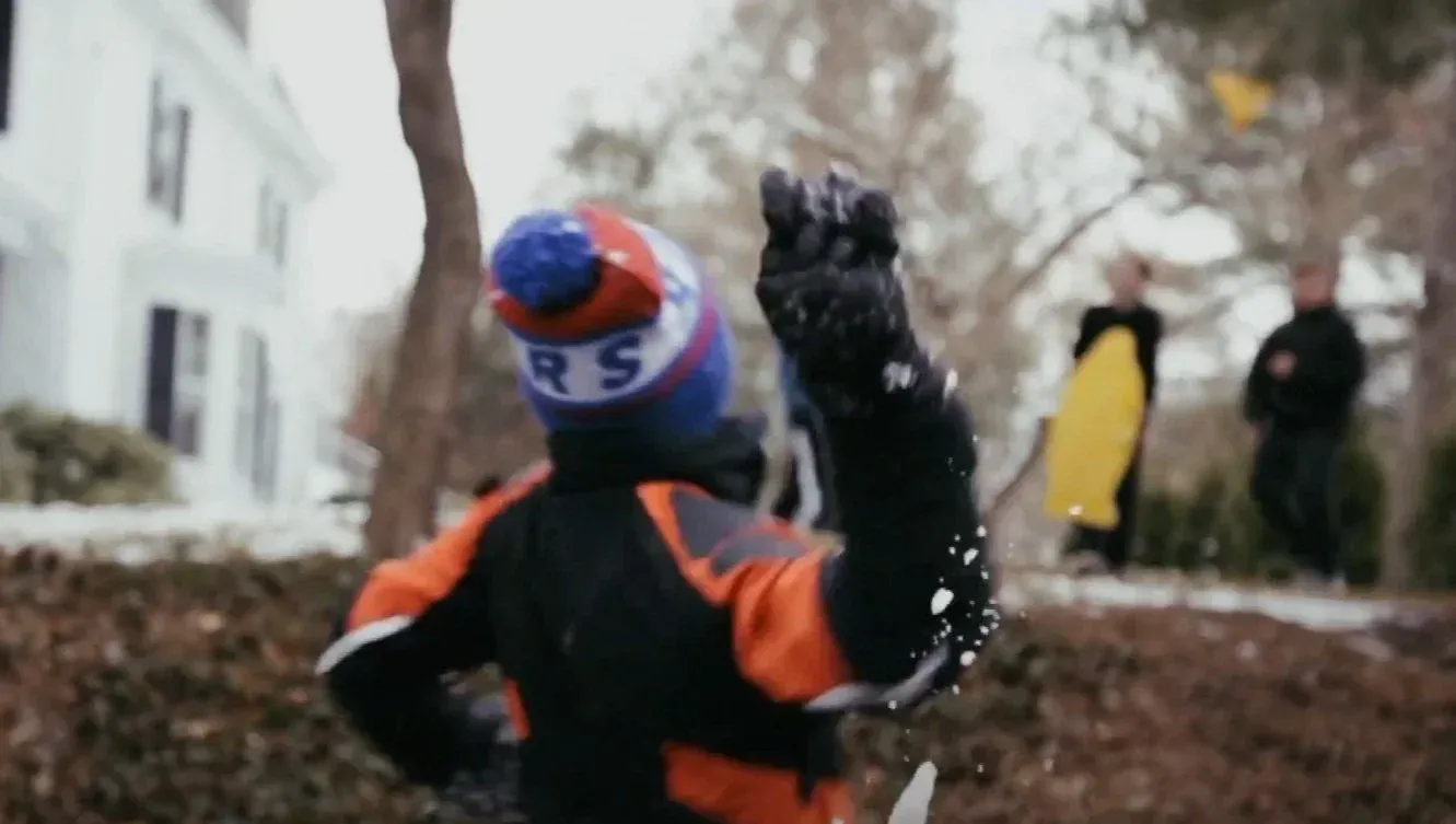 Film still from Snowballs — neighbors playing in the snow in Tarrytown, NY.