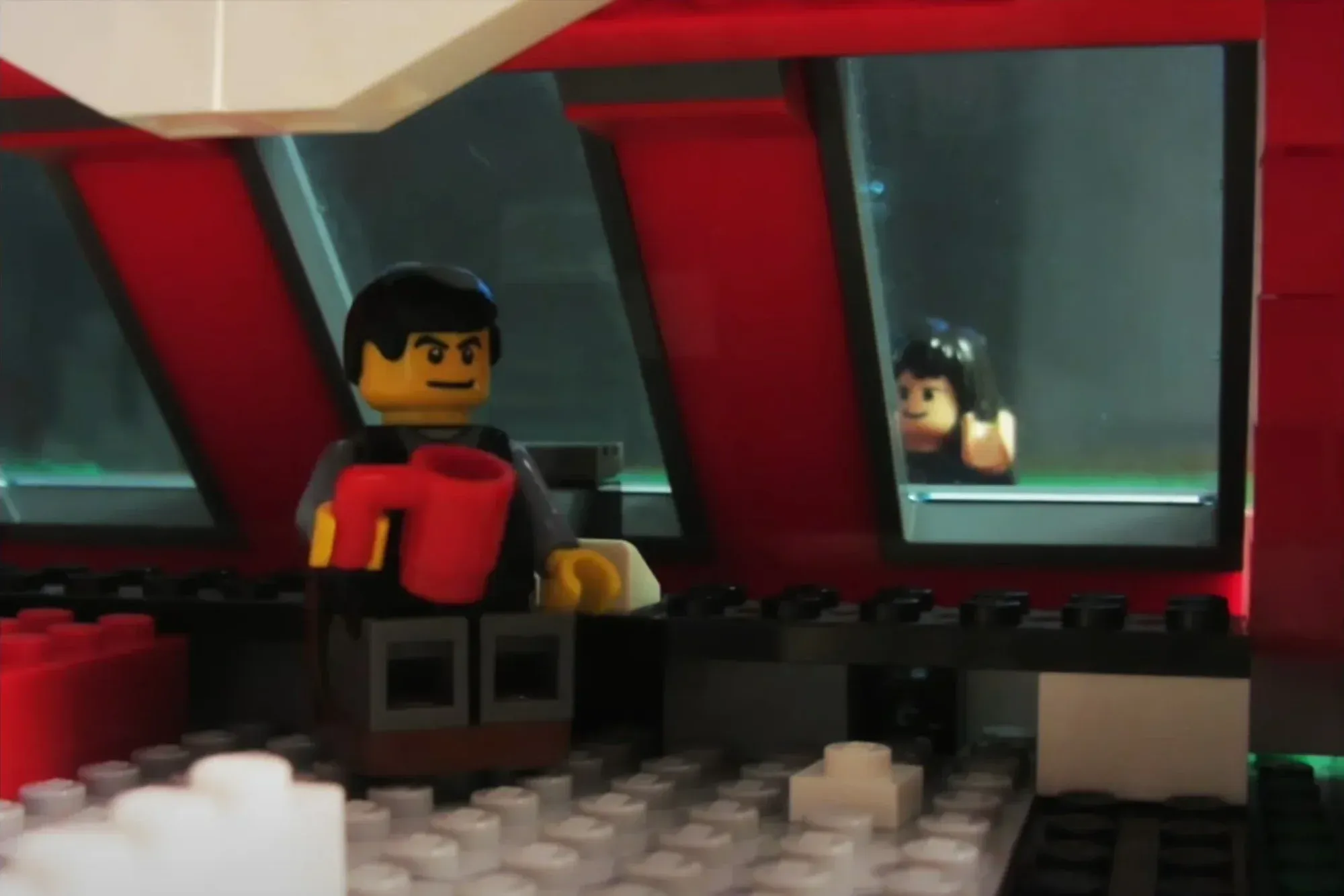 Film still from the Paper Towns LEGO stop motion — minifigures arranged in a scene from the novel.