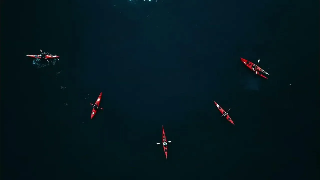Aerial drone still of kayakers in formation on the Hudson River near Kingsland Point Park, Sleepy Hollow.